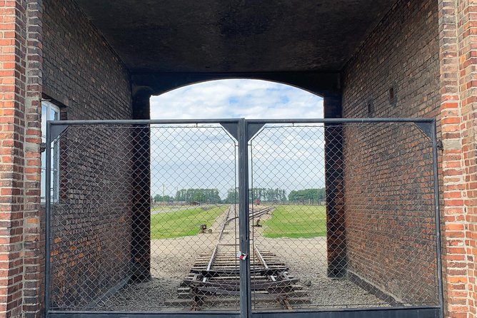 Auschwitz-Birkenau guided tour from Krakow - private car - Auschwitz I, walking the route through gate, barracks, and ruins