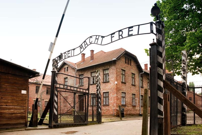 From Krakow: Auschwitz-Birkenau Guided Tour & Transportation - Auschwitz I: entering through Arbeit macht frei and getting your bearings fast