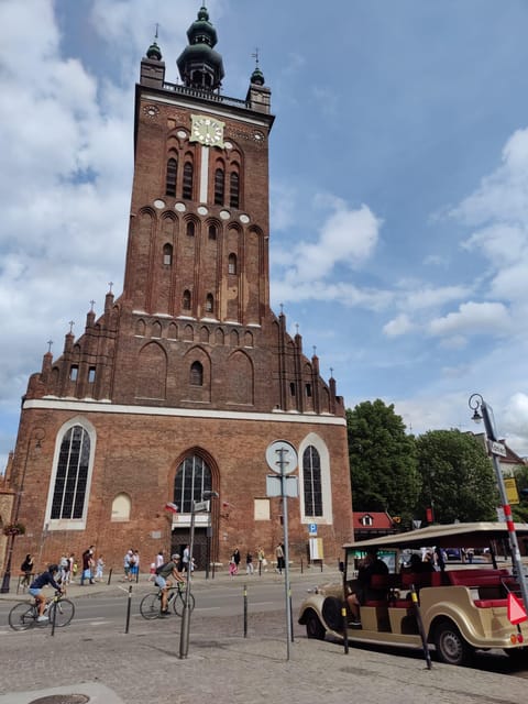 Gdansk: City Sightseeing Tour Eco Electric Buggy Golf Cart - Church and gates: seeing Gdansk’s story in brick and stone