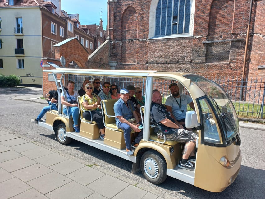 Gdansk: Private Top City Tour by Electric Cart & Live Guided - Views along the Motława: port cranes, trade, and river history