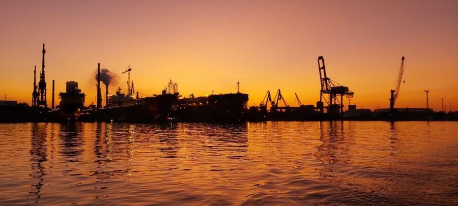 Gdańsk: Scenic Sunset Cruise with Welcome Drink - Getting aboard at Oria Magic House, then settling into port views