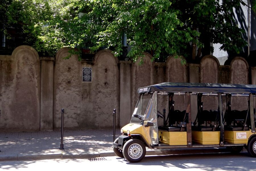 Krakow: Jewish Quarter and Former Ghetto Tour by Golf Cart - Pharmacy Under the Eagle and surviving wall fragments