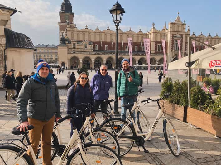 Krakow: Old Town and Kazimierz Guided Bike Tour - Wawel Dragon Statue and the Vistula pass-by, a fast mood shift