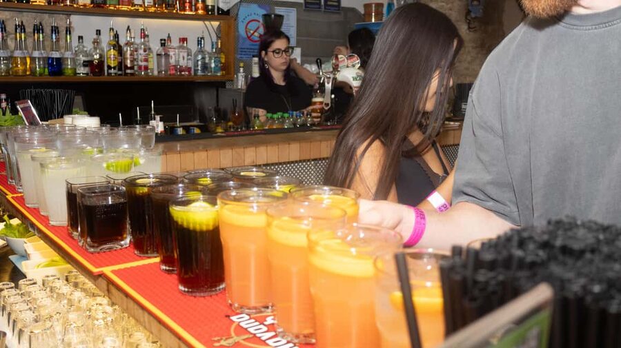 Krakow: Pub Crawl 1H Open Bar, VIP Entry & Welcome Shots - Drinking games, music, and the photographers’ flash moments