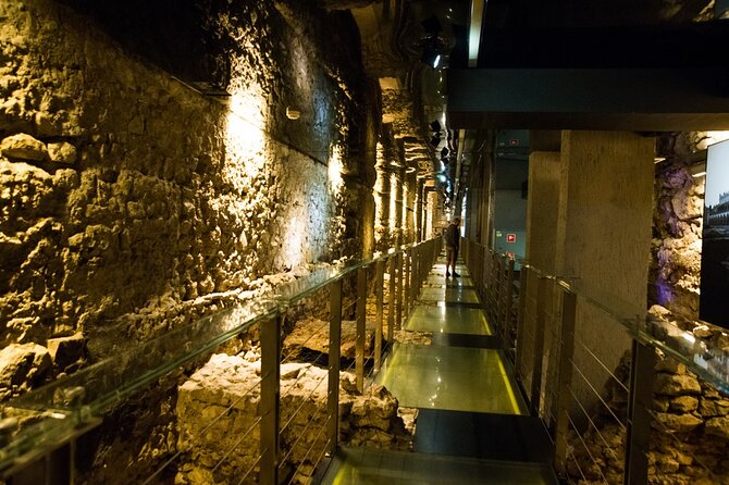 Krakow: Rynek Underground Museum Skip-the-line Guided Tour - Walking the underground paths, merchant stalls, and ancient street traces