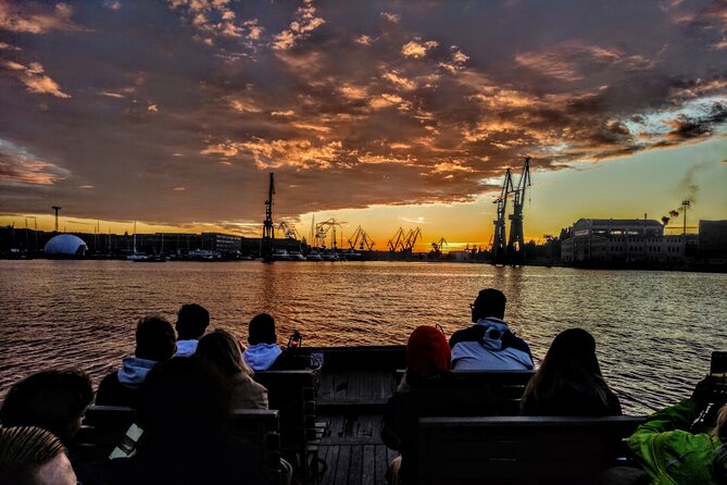 Sunset on the Shipyard and Old Town Evening Cruise - Stop 3, Ołowianka and Granary Island: bridges, museums, and the Blue Lamb