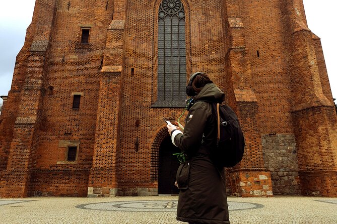 The Birthplace of Poland: A Self-Guided Audio Tour of Poznań - Walking Śródka District: Independence, a Mural, and Saint Margaret
