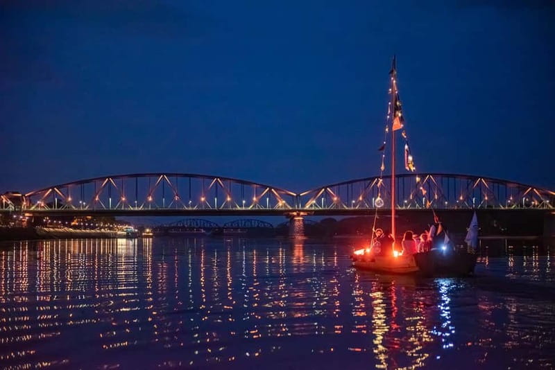 Toruń: Sunset on the Vistula From a Traditional Boat. - Sunset and dusk timing: the romance of bridges turning on slowly
